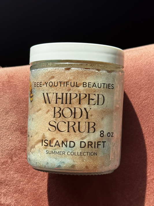 Jar of 'Whipped Body Scrub' by Bee-youtiful Beauties on a textured surface

